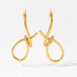 Minimalist gold knotted hoop earrings in polished stainless steel with modern fluid design