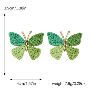 Detail view of woven butterfly earrings with green raffia and size dimensions