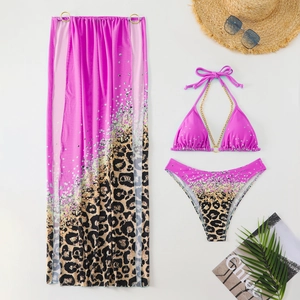Detailed view of pink leopard print bikini set with gold chain and matching sarong