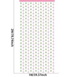 Detail of 1x2m party curtain featuring green witch hats and pink crowns for festive decor