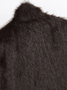 Close-up of premium dark faux fur vest showing soft texture and high-quality neckline