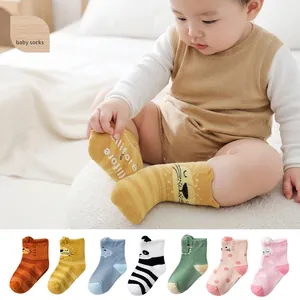 Class A cartoon cotton baby socks with non-slip grips featuring lion and panda designs