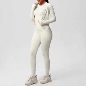 Detail view of a cream white three-piece yoga set with zip jacket and high waist leggings