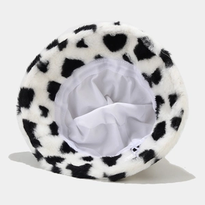 Winter plush bucket hat with black and white heart pattern and soft faux fur texture