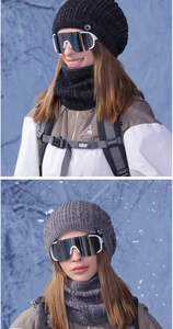 Detail of knitted winter beanie set with thick neck warmer and professional ski goggles