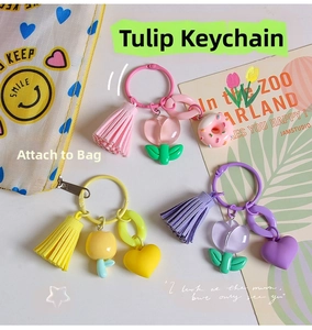 Detailed view of colorful resin tulip keychains with matching tassels and heart charms