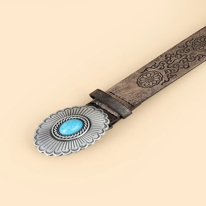 Vintage brown embossed leather belt with floral patterns and oval turquoise buckle