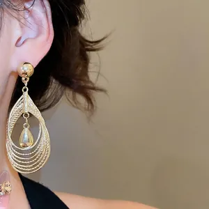 Exaggerated multilayer hollow teardrop pendant earrings in gold finish for women