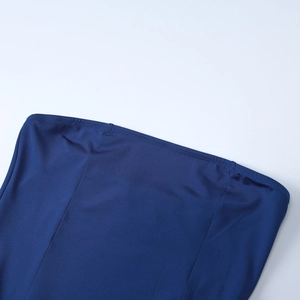 Detail of royal blue fabric featuring double-needle hemmed edges and smooth elastic texture