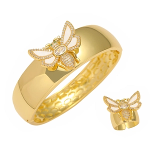 Golden bee jewelry set with open bangle and ring featuring crystals and white enamel