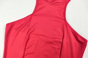 Detailed close-up of the ruffled stand-up collar and stitching on this red sleeveless dress