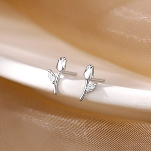 Elegant 925 sterling silver tulip stud earrings with sparkling zircon on silk background