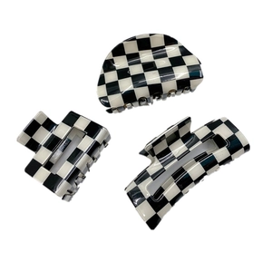 Three-piece checkered hair claw set featuring round, square and bar shapes with glossy finish