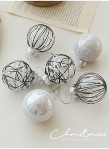 Detail of 6cm Christmas balls with black geometric lines and white glitter stars