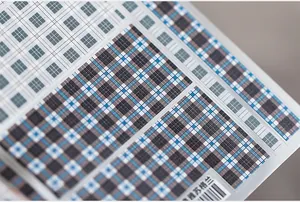 Macro shot of Scottish plaid patterns in blue and grey for 5D nail art stickers