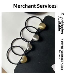 Close-up of four high-elastic hair ties with gold and silver brushed metal heart charms
