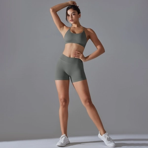 Detail of high-waist seamless compression shorts in sage green for athletic yoga set