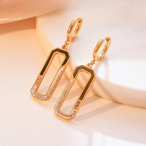 Chic gold-plated titanium earrings with black enamel and zircons on marble base
