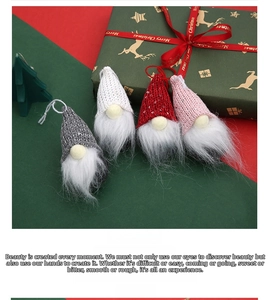 Set of four knitted Christmas gnomes with sequins and plush beards in a festive gift box
