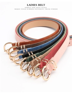 Detail of colorful nubuck leather ladies belts with elegant gold double ring buckles