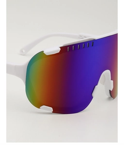 Detail of white cycling glasses with rainbow gradient lenses and anti-slip nose pads
