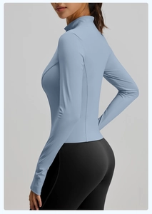 Detail of light blue slim-fit sports jacket with high collar and ergonomic side seams