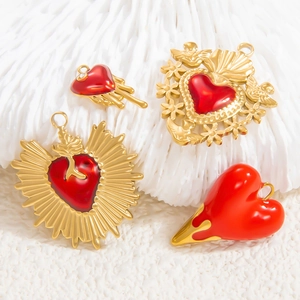 Red enamel and 18k gold heart pendants for necklaces in various artistic styles
