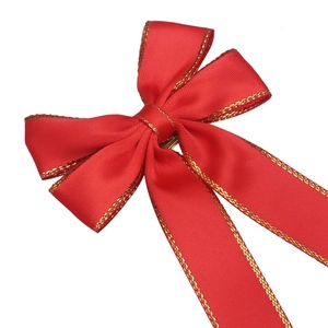 Elegant red velvet Christmas bow with gold stitched edges for gift wrapping and hair decor