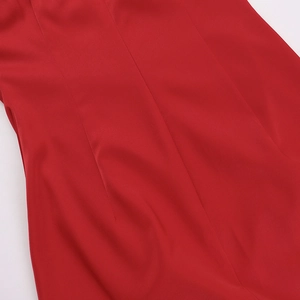 Detail shot of red satin dress fabric with precision double-needle stitching quality