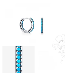 Close-up of S925 silver hoop earrings with heart-shaped cutouts and turquoise inlay