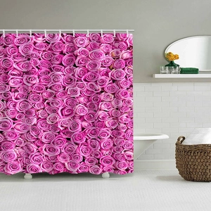 Detail of waterproof polyester shower curtain with dense pink rose floral pattern and C-hooks