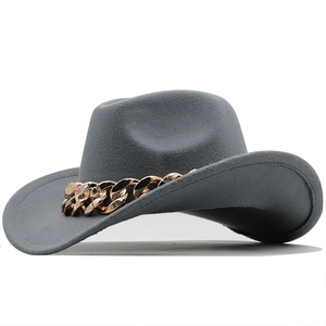 Detail of grey felt wool hat featuring a thick gold metal chain and cattleman crease