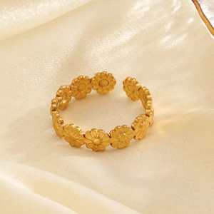 Minimalist gold stainless steel daisy ring with adjustable open band on silk