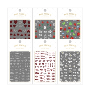 Self-adhesive 3D nail sticker set featuring assorted floral, heart, and letter patterns