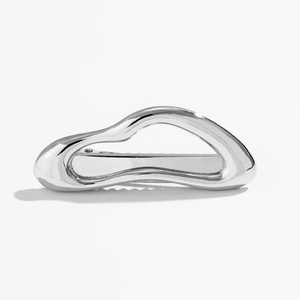 Detail of irregular silver metal hairpin with high-polished finish on white background