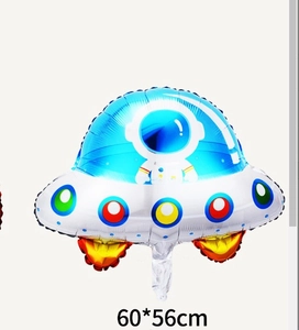 Detail of astronaut UFO foil balloon with blue and silver colors for space party decor