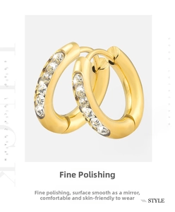 Close-up of gold-plated stainless steel hoop earrings with micro-pave cubic zirconia