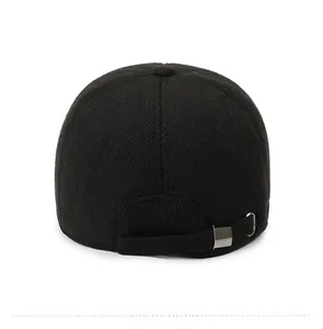 Close-up of the black knit winter baseball cap featuring an adjustable metal buckle back