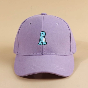 Detailed close-up of cute cartoon dinosaur embroidery on a lavender cotton baseball cap