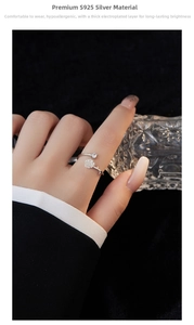 Macro detail of S925 silver camellia ring featuring elegant floral petals and zircon stone
