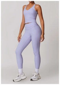 Macro detail of lavender yoga set showing cross back tank top and high waist leggings