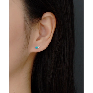 Elegant S925 sterling silver stud earring with blue opal stone on female model ear