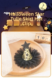 Macro view of Halloween star tulle skirt hat clip with a golden wizard cap and black star