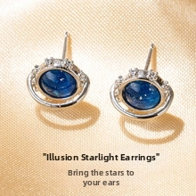 Macro shot of silver planetary stud earrings with blue starry stone and zircon rings