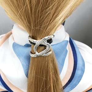 Minimalist metallic twisted U-shaped silver hair tie for women's ponytail styles