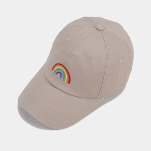 Detail of beige cotton baseball cap featuring high-quality rainbow embroidery and twill texture