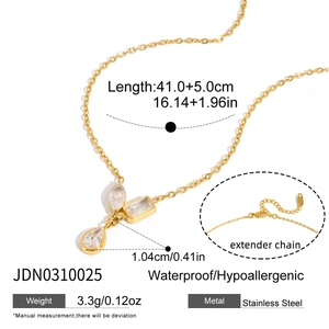 Detail view of gold stainless steel necklace with teardrop zircon and extender chain info