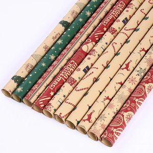 Christmas kraft wrapping paper rolls with festive reindeer and snowflake patterns