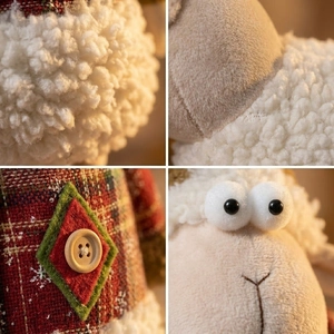 Detail shot of Christmas sheep plush showing curly wool, plaid fabric and wooden button