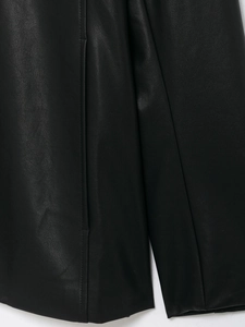 Detailed close-up showing texture and stitching of premium black coated faux leather jacket